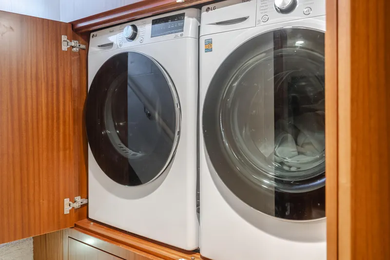 Slide: The Image of Laundry appliances in 2015 Ocean Alexander 72 yacht's wooden cabinet. - 33