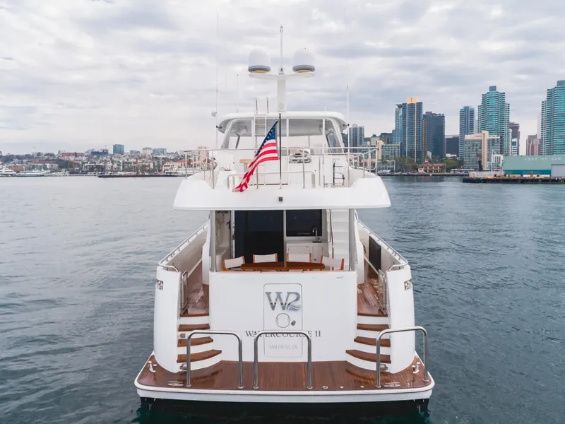 Slide: The Image of Ocean Alexander 72 yacht, 2015 model, docked with city skyline in background. - 5