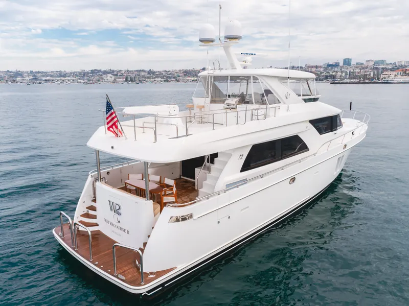 Slide: The Image of Luxury 2015 Ocean Alexander 72 yacht on calm waters, featuring elegant design and spacious deck. - 7