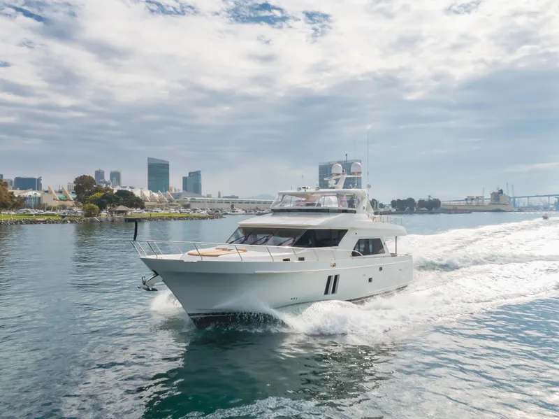 Slide: The Image of Ocean Alexander 72 yacht cruising in a harbor, 2015 model, with city skyline background. - 8