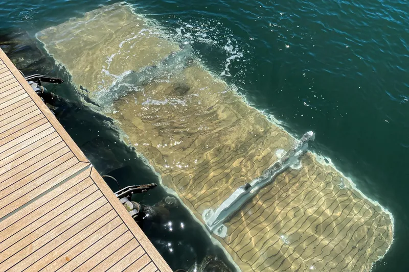 Slide: The Image of Submerged Azimut 62S yacht near dock, 2009 model, partially visible underwater. - 13