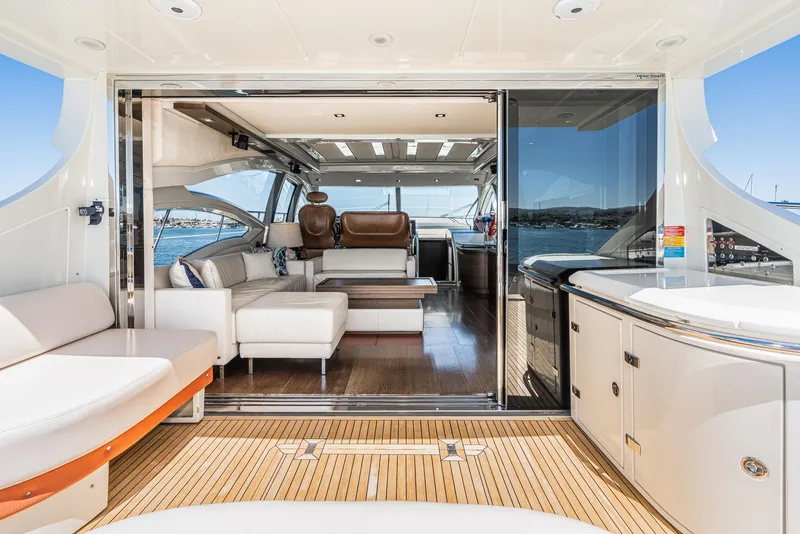Slide: The Image of 2009 Azimut 62S yacht interior with luxurious seating and modern design. - 16