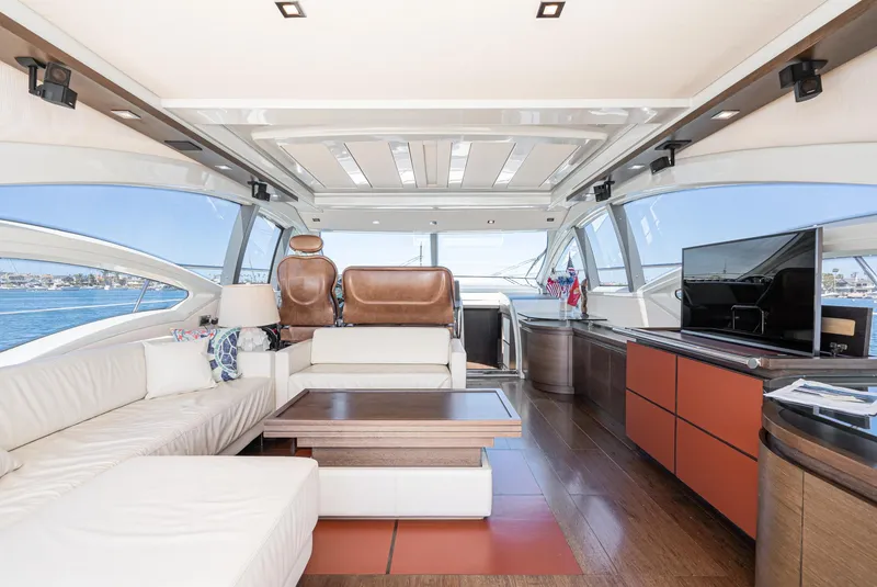 Slide: The Image of Luxurious interior of a 2009 Azimut 62S yacht with modern furnishings and panoramic windows. - 18
