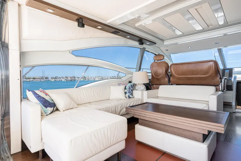 Slide: The Image of Luxurious interior of 2009 Azimut 62S yacht with white leather seating and ocean view. - 20