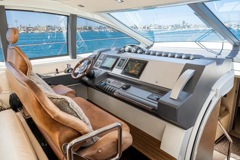 Slide: The Image of Luxurious 2009 Azimut 62S yacht cockpit with leather seating and advanced navigation controls. - 23