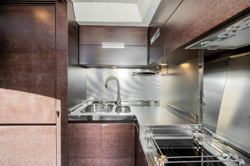 Slide: The Image of Modern kitchen in 2009 Azimut 62S yacht with sleek cabinetry and stainless steel fixtures. - 29