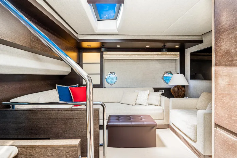 Slide: The Image of Luxurious interior of 2009 Azimut 62S yacht with modern seating and skylight. - 32