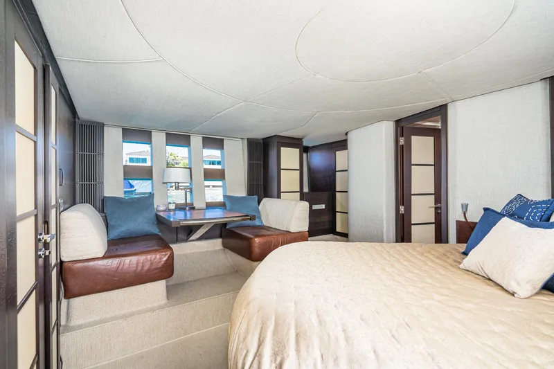 Slide: The Image of Luxurious interior of 2009 Azimut 62S yacht with elegant seating and bedding. - 34