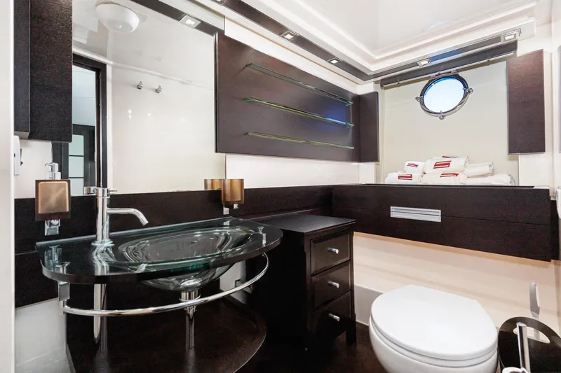 Slide: The Image of Luxurious bathroom interior of 2009 Azimut 62S yacht with modern fixtures and porthole window. - 37