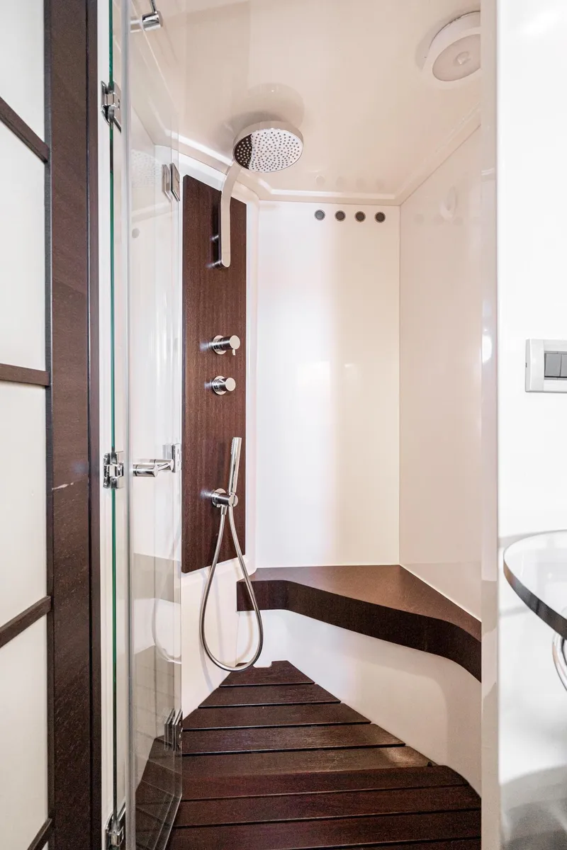 Slide: The Image of Luxurious shower in 2009 Azimut 62S yacht with modern fixtures and wooden accents. - 38