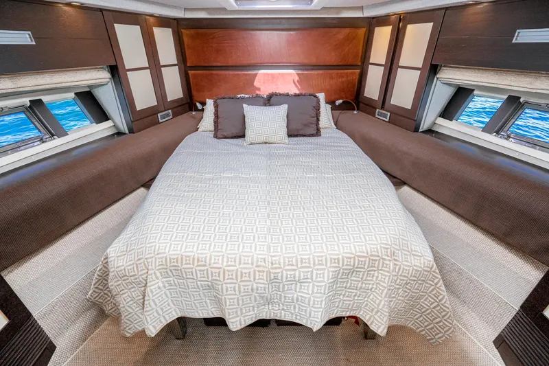 Slide: The Image of Luxurious bedroom interior of 2009 Azimut 62S yacht with elegant bedding and ocean view. - 40