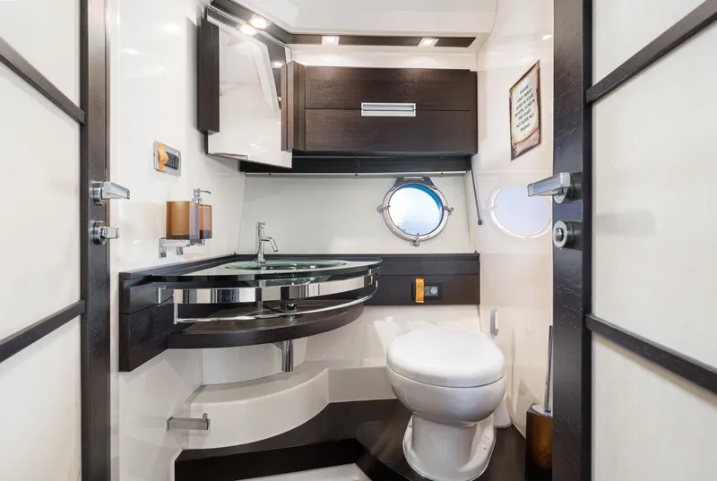 Slide: The Image of Luxurious bathroom in 2009 Azimut 62S yacht, featuring modern fixtures and elegant design. - 42