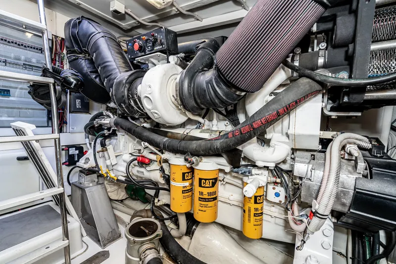 Slide: The Image of Engine room of 2009 Azimut 62S yacht, featuring CAT filters and complex machinery. - 45