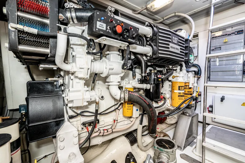 Slide: The Image of Engine room of a 2009 Azimut 62S yacht, showcasing detailed machinery and components. - 47