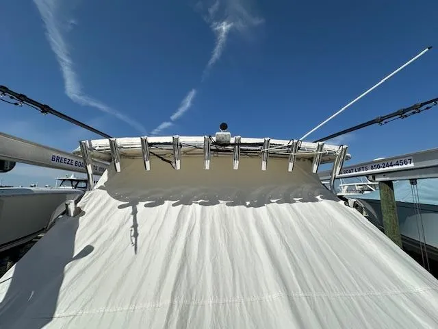 Slide: The Image of 2021 AmeraCat 27 Gen II DC boat with covered deck under clear blue sky. - 15