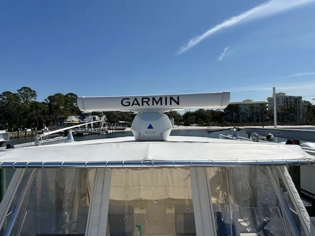 Slide: The Image of 2021 AmeraCat 27 Gen II DC boat with Garmin radar, docked under clear blue sky. - 20