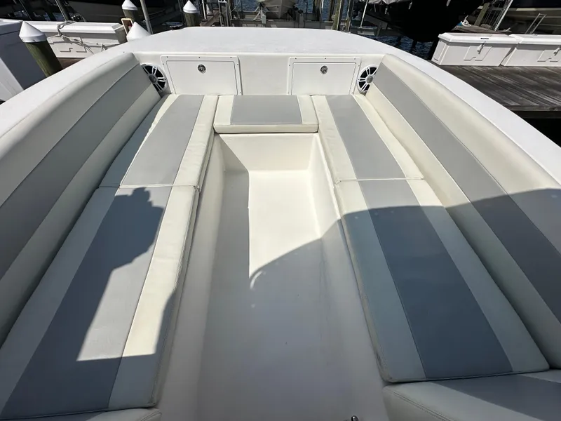 Slide: The Image of 2021 AmeraCat 27 Gen II DC boat interior with cushioned seating and storage compartments. - 23