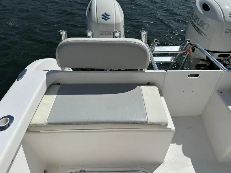Slide: The Image of 2021 AmeraCat 27 Gen II DC boat with Suzuki engines, featuring a cushioned seating area. - 32