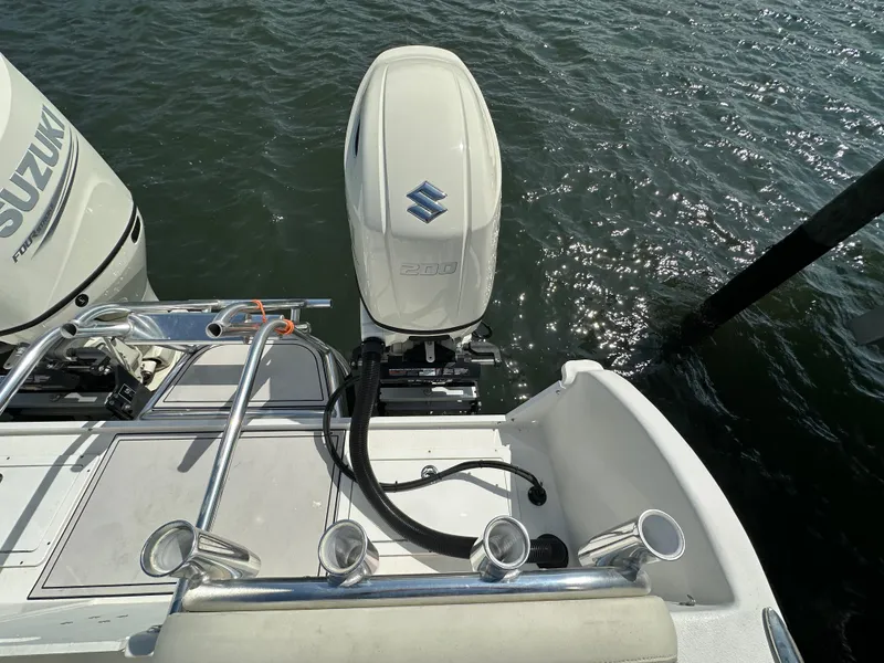 Slide: The Image of 2021 AmeraCat 27 Gen II DC boat with Suzuki outboard engines on water. - 33