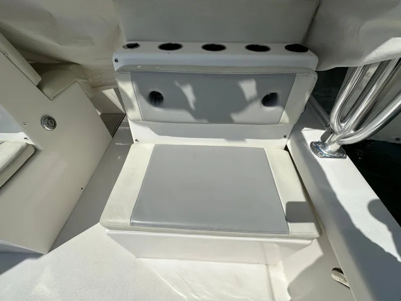 Slide: The Image of 2021 AmeraCat 27 Gen II DC boat interior with cushioned seating and cup holders. - 39