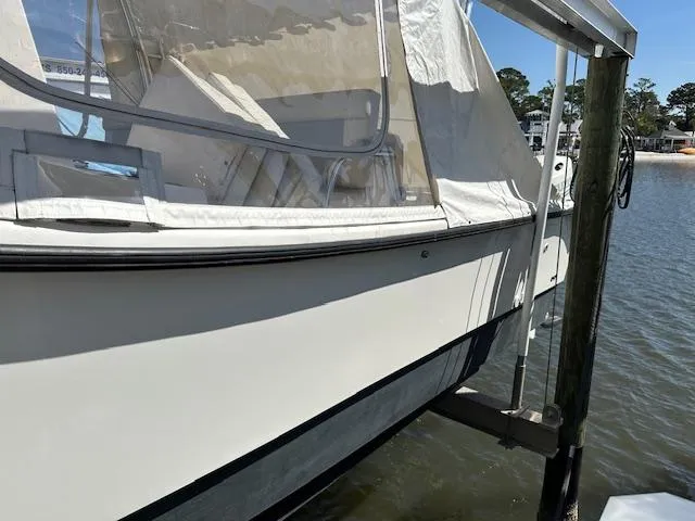 Slide: The Image of 2021 AmeraCat 27 Gen II DC boat docked by the water. - 4