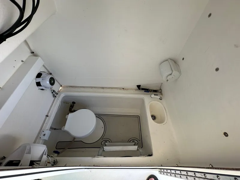 Slide: The Image of 2021 AmeraCat 27 Gen II DC boat interior bathroom with toilet and sink. - 40