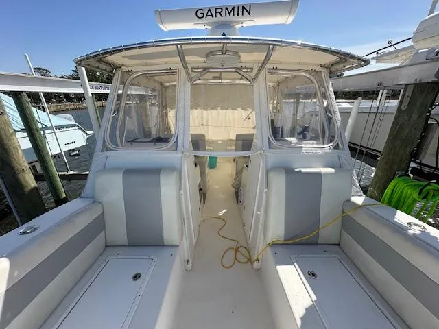 Slide: The Image of 2021 AmeraCat 27 Gen II DC boat with Garmin equipment, docked at a marina. - 6