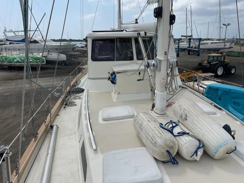 Slide: The Image of Seaton Custom Ketch 2014 on deck, docked with fenders and rigging visible. - 11
