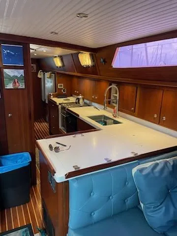 Slide: The Image of Interior of 2014 Seaton Custom Ketch yacht with modern kitchen and wooden cabinetry. - 15
