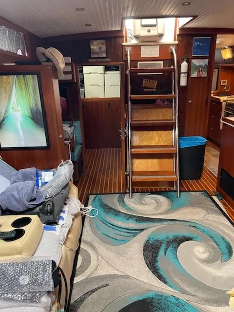 Slide: The Image of Interior of 2014 Seaton Custom Ketch with wooden flooring and nautical decor. - 16