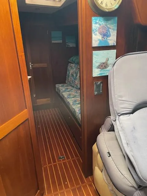 Slide: The Image of Interior of 2014 Seaton Custom Ketch with wooden paneling and nautical decor. - 19