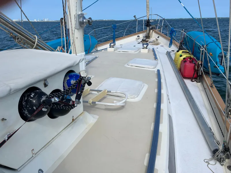 Slide: The Image of Seaton Custom Ketch 2014 sailboat deck with winches, ropes, and ocean view. - 28