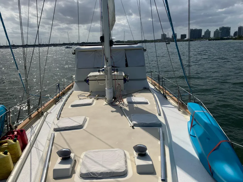 Slide: The Image of 2014 Seaton Custom Ketch sailboat on water, city skyline in background. - 30