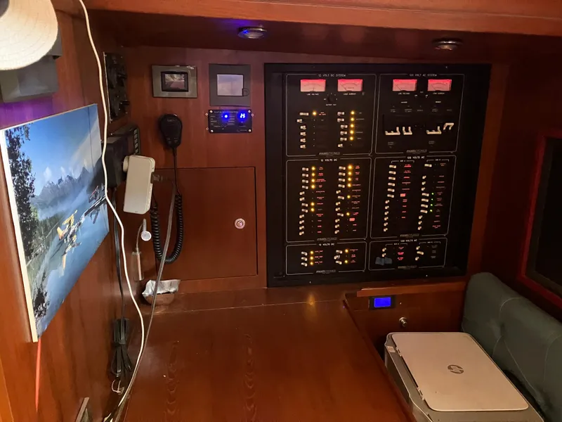 Slide: The Image of Control panel inside 2014 Seaton Custom Ketch yacht, featuring navigation and communication equipment. - 32