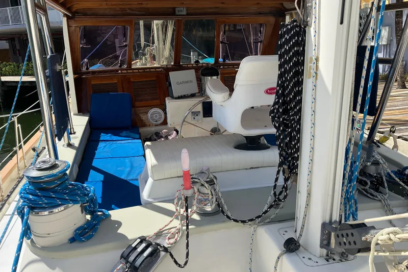 Slide: The Image of Cockpit of 2014 Seaton Custom Ketch with ropes, seating, and navigation equipment. - 37