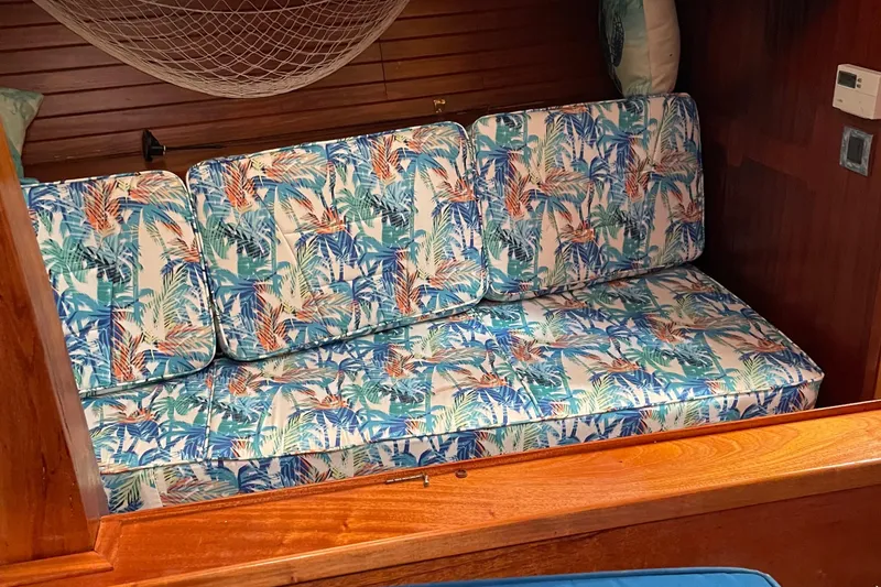Slide: The Image of Floral-patterned seating inside a 2014 Seaton Custom Ketch yacht cabin. - 4
