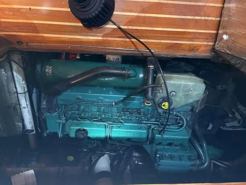 Slide: The Image of Engine compartment of 2014 Seaton Custom Ketch, showcasing a well-maintained marine engine. - 9