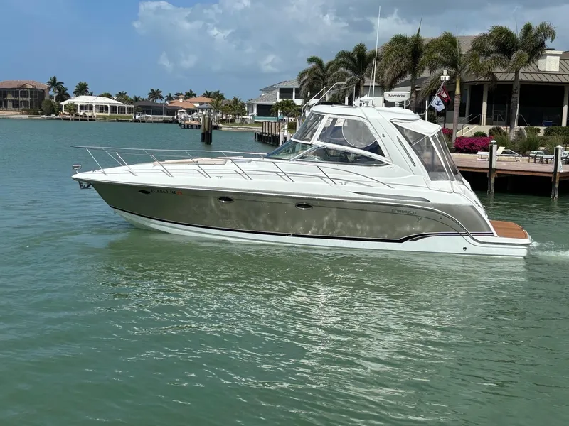 Slide: The Image of 2008 Formula 37 PC yacht cruising in a tropical marina with palm trees. - 10