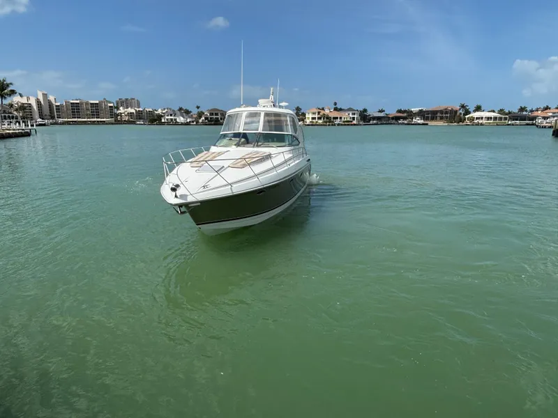 Slide: The Image of 2008 Formula 37 PC yacht cruising in a serene, tropical bay. - 13