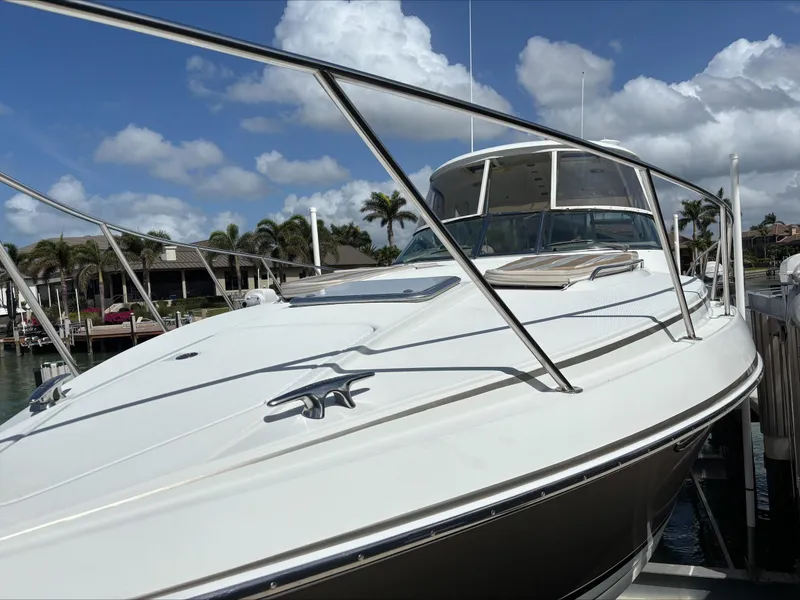 Slide: The Image of 2008 Formula 37 PC yacht docked under a clear blue sky. - 14