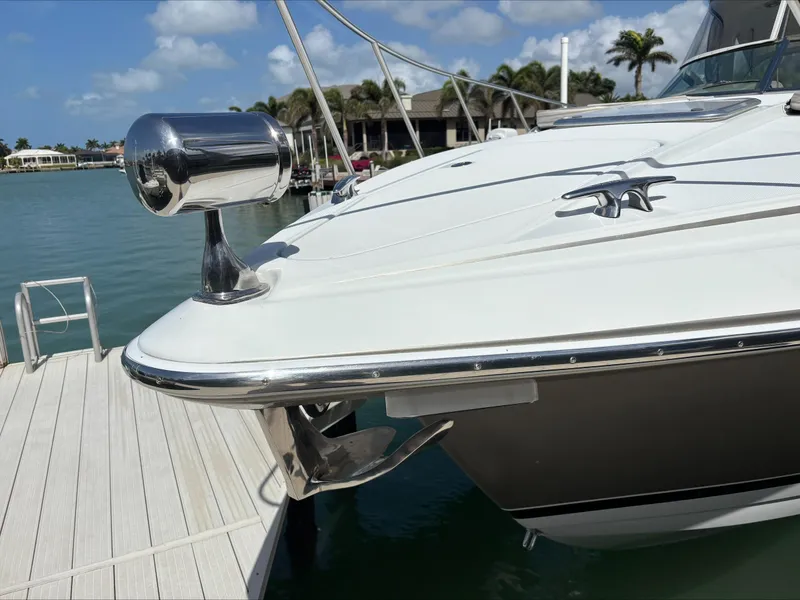 Slide: The Image of 2008 Formula 37 PC yacht docked, showcasing sleek bow design and chrome details. - 15