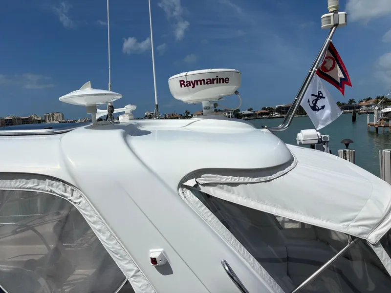 Slide: The Image of 2008 Formula 37 PC yacht with Raymarine radar, docked under clear blue skies. - 18