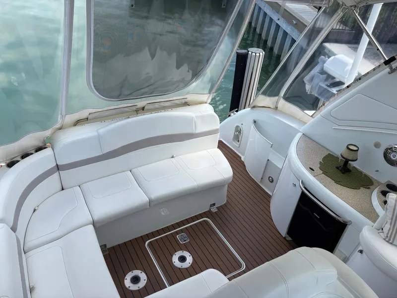 Slide: The Image of 2008 Formula 37 PC yacht interior with white seating and wood flooring. - 20