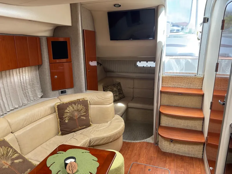 Slide: The Image of Interior of 2008 Formula 37 PC yacht with beige seating, wooden accents, and a mounted TV. - 25