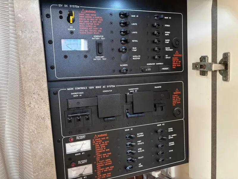 Slide: The Image of Electrical control panel in a 2008 Formula 37 PC boat, featuring switches and circuit breakers. - 26