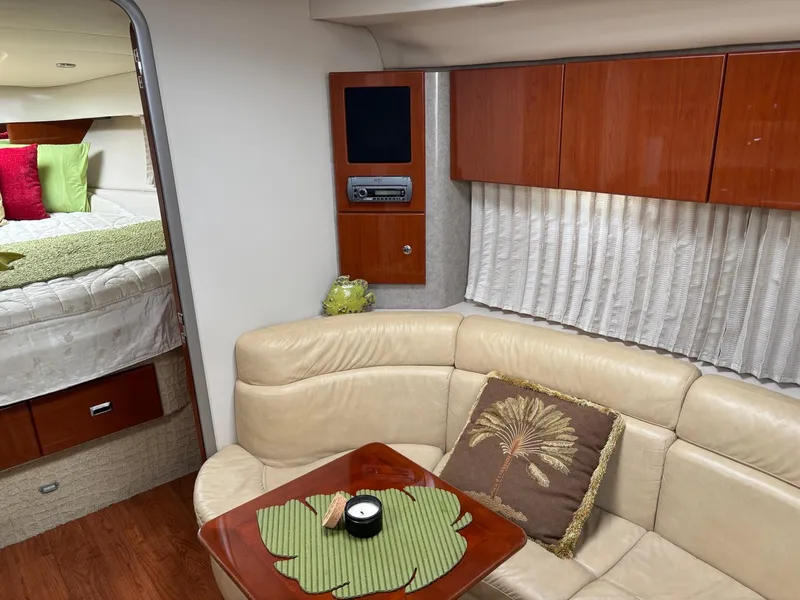 Slide: The Image of Interior of a 2008 Formula 37 PC yacht with beige seating and wooden accents. - 27