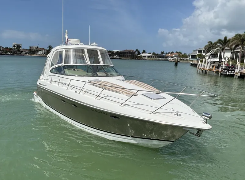 Slide: The Image of 2008 Formula 37 PC yacht cruising in a serene coastal waterway. - 3
