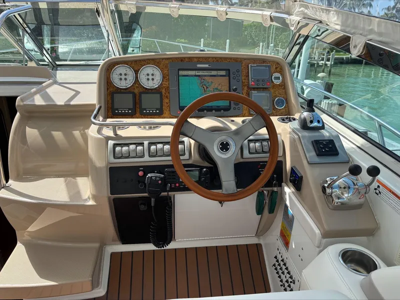 Slide: The Image of 2008 Formula 37 PC yacht helm with navigation controls and wooden steering wheel. - 31