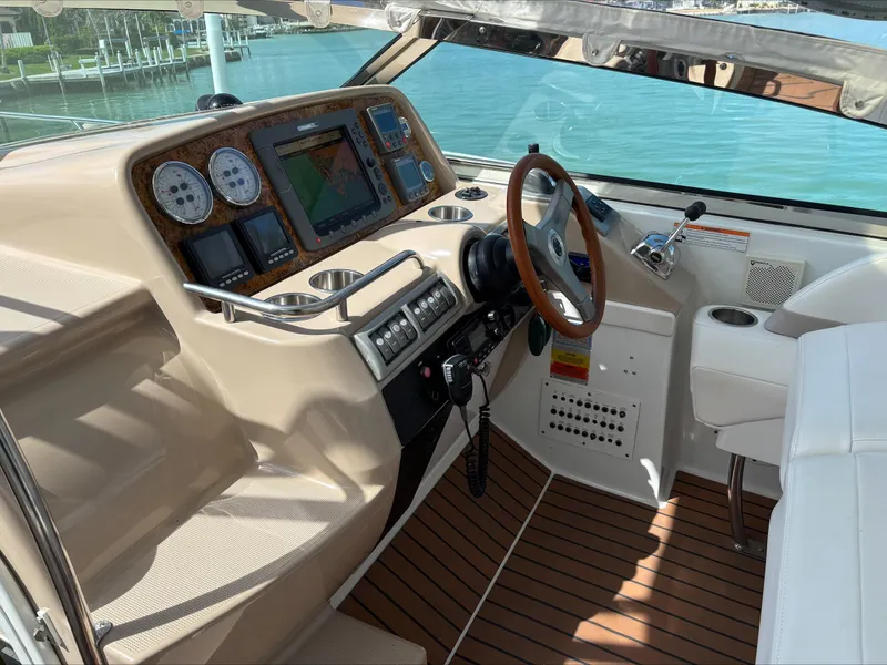 Slide: The Image of 2008 Formula 37 PC boat helm with wood accents and modern navigation equipment. - 32