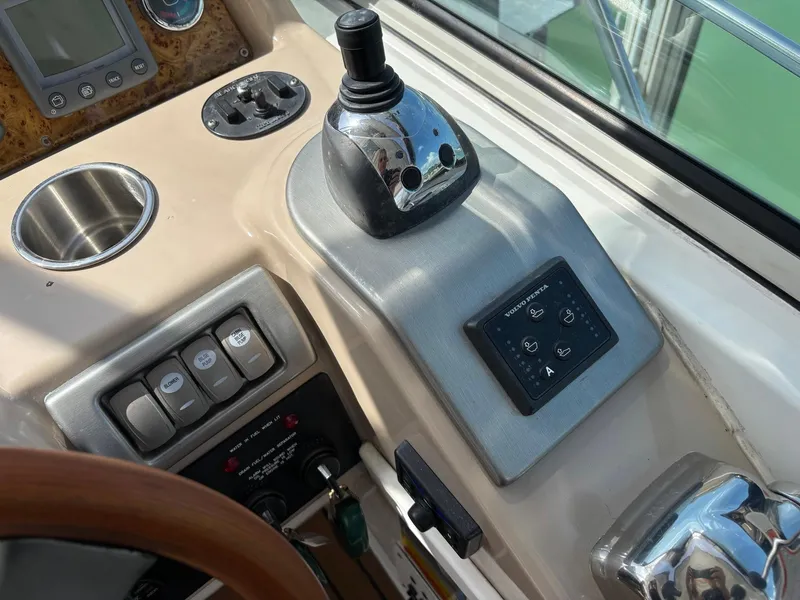Slide: The Image of Control panel of a 2008 Formula 37 PC boat with joystick and switches. - 33